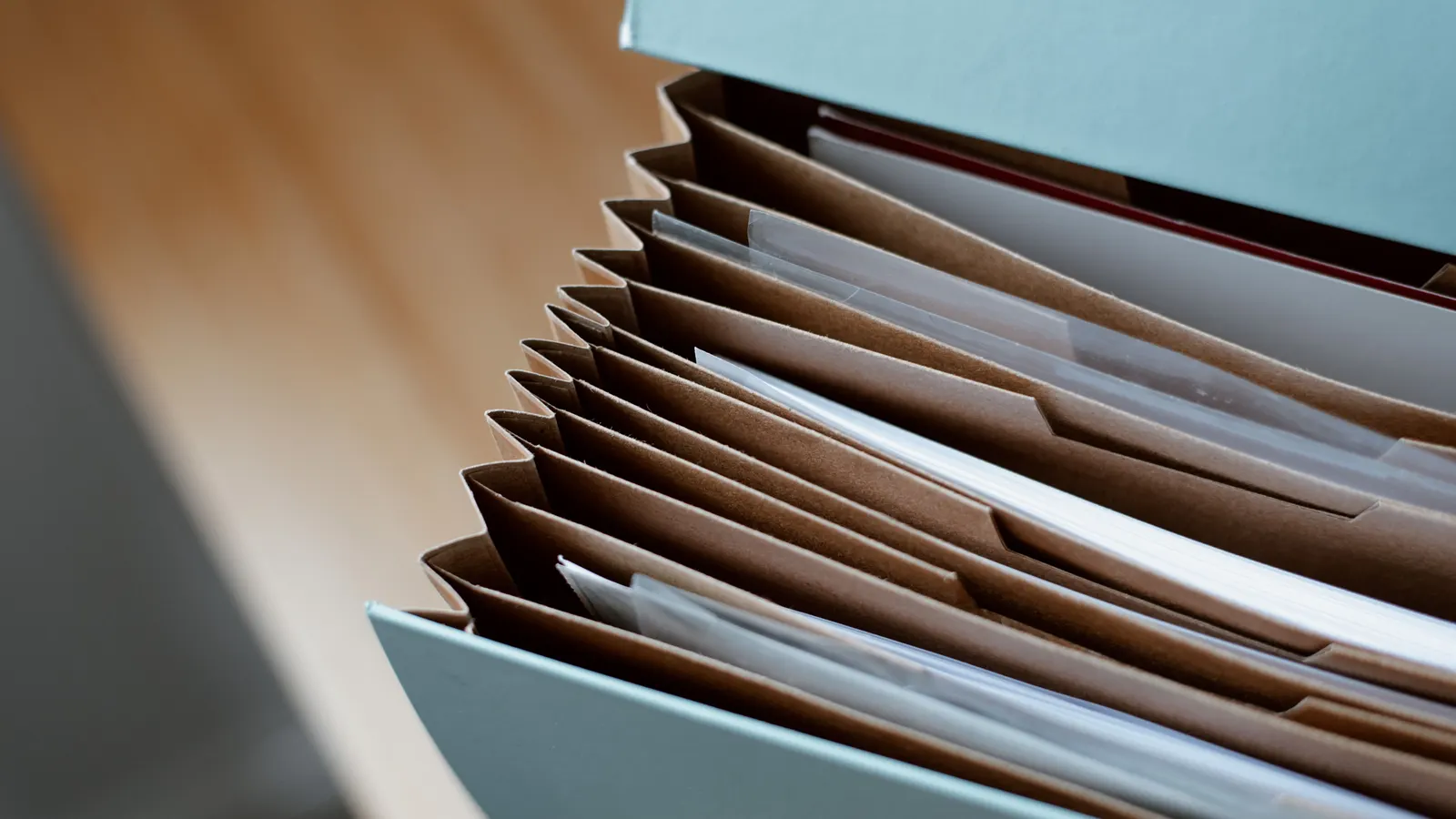 Business records organized in document folders.