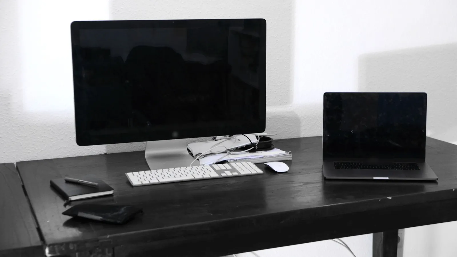 Desktop computer and laptop in a business workspace.