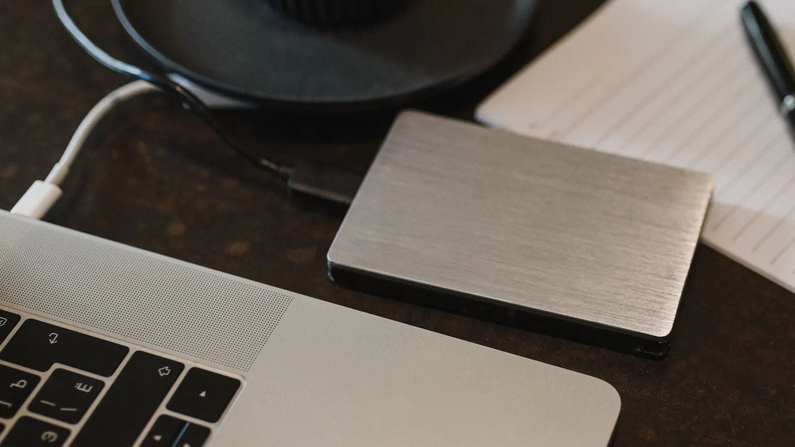 External hard drive connected to a laptop for data transfer.